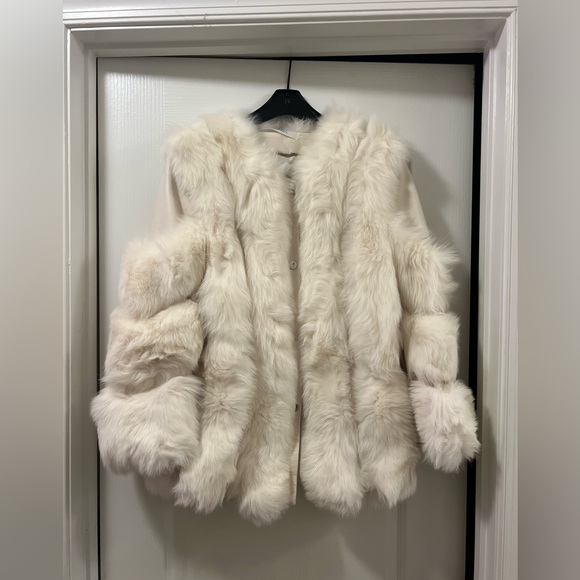 That’s beautiful. AMBIANCE Fur jackethas leather and fur. Send me an offer